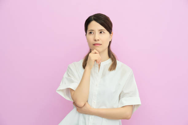 istock A young woman looking up and thinking 2177834001