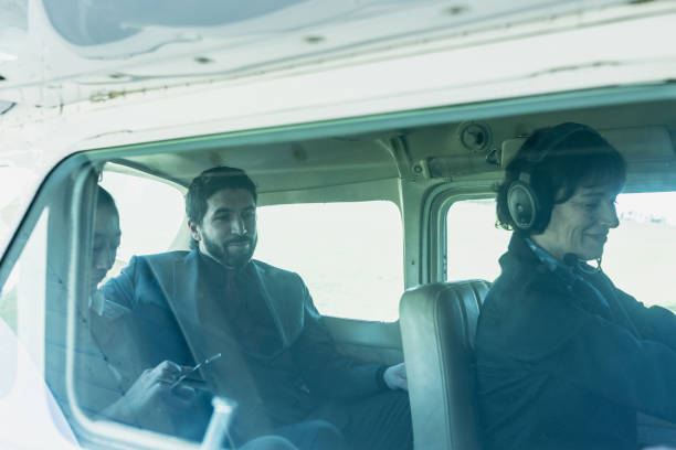 istock Airplane pilot taking business people on a private plane 2177834078