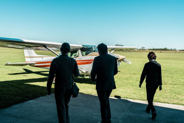 istock Business persons walking to a private airplane 2177834122