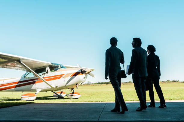 istock Business persons walking to a private airplane 2177834133