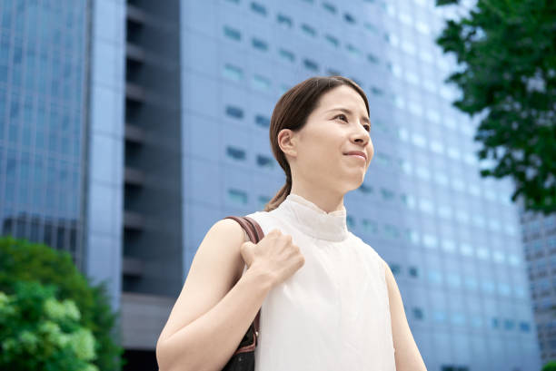 istock A woman commuting in a business district 2177834828