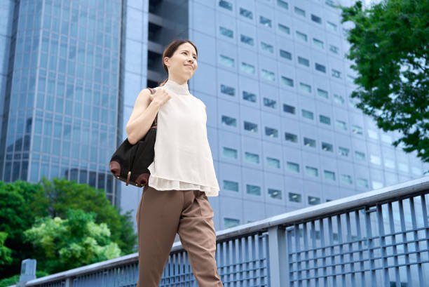 istock A woman commuting in a business district 2177834855