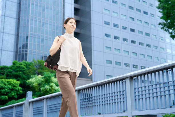 istock A woman commuting in a business district 2177834916