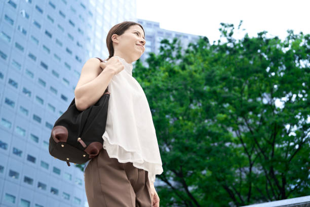 istock A woman commuting in a business district 2177834930