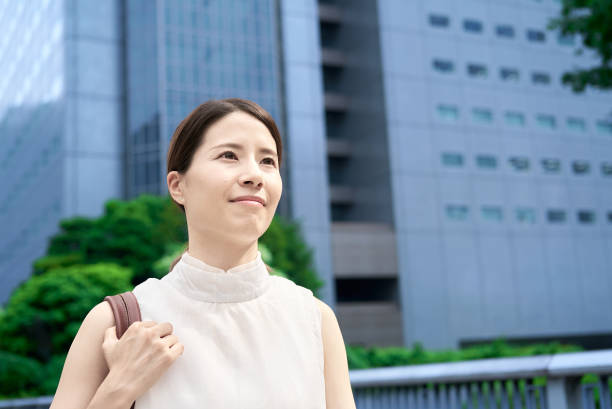 istock A woman commuting in a business district 2177834949