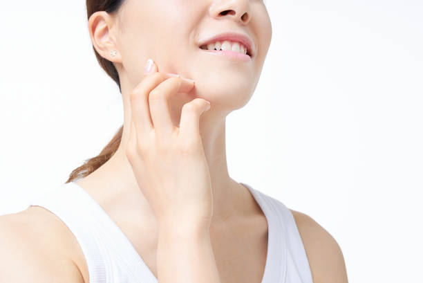 istock A woman checking her skin condition 2177834984