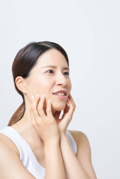 istock A woman checking her skin condition 2177835049