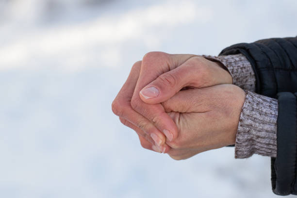 istock Womens hands in winter. Warmth and hand warming on cold winter days. 2177835816