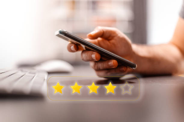 istock Customer is rating satisfaction by selecting four stars on an online application. Positive feedback, customer experience. Importance of customer reviews and satisfaction in business. 2177837889