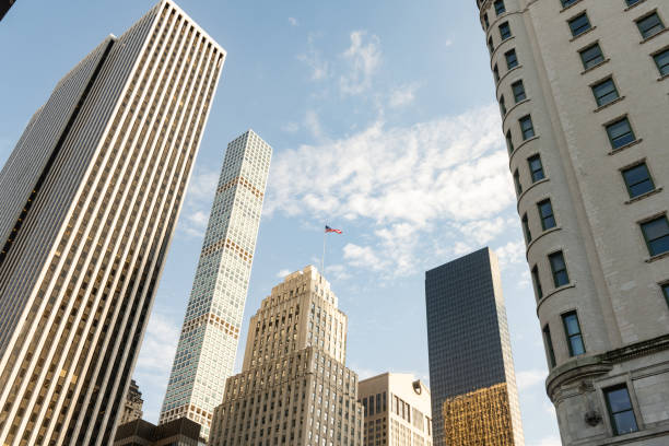 This is a low angle view of NYC buildings in Midtown East on a sunny day.