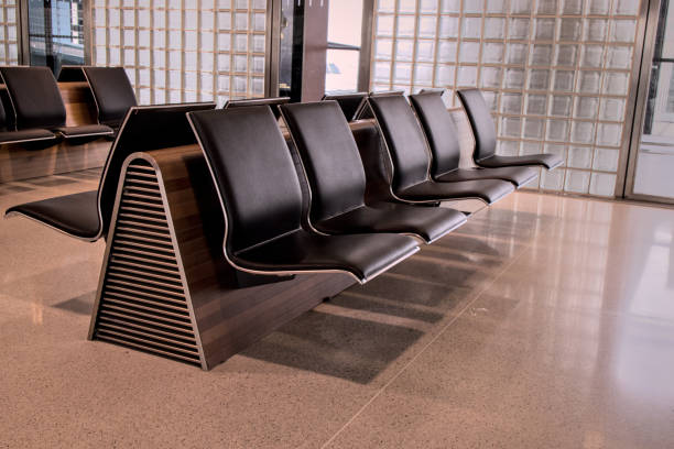 istock empty seats at international gate (zurich airport, switzerland) waiting area before flight closed row rows of chairs (seat chair) sitting terminal waiting flight delay departure arrival 2177838179