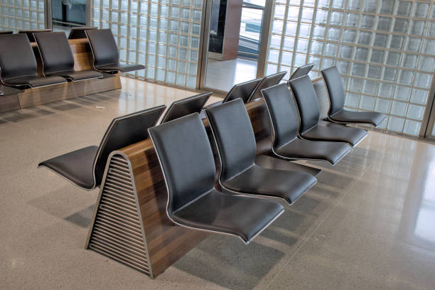 istock empty seats at international gate (zurich airport, switzerland) waiting area before flight closed row rows of chairs (seat chair) sitting terminal waiting flight delay departure arrival 2177838181