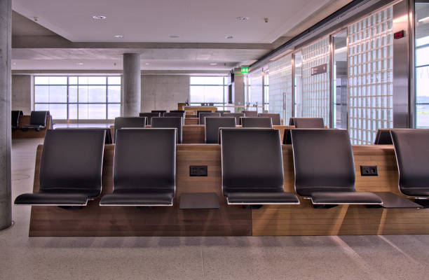istock empty seats at international gate (zurich airport, switzerland) waiting area before flight closed row rows of chairs (seat chair) sitting terminal waiting flight delay departure arrival 2177838301