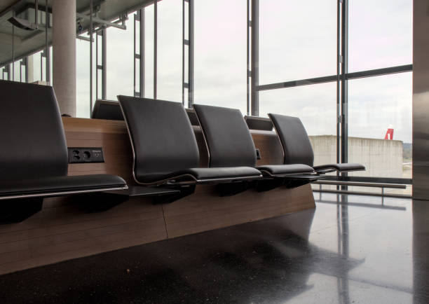 istock empty seats at international gate (zurich airport, switzerland) waiting area before flight closed row rows of chairs (seat chair) sitting terminal waiting flight delay departure arrival 2177838312