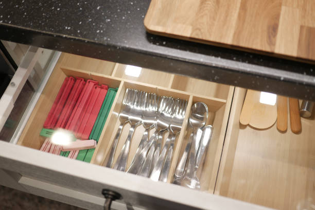 istock Organize kitchen drawer for efficient storage of cutlery and utensils, creating a modern interior 2177843900