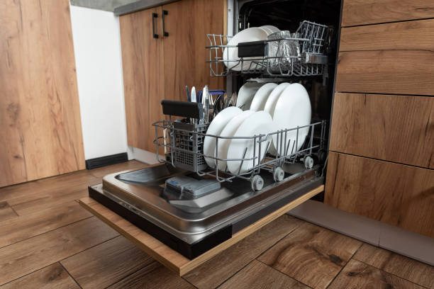 istock kitchen with built-in open dishwasher with clean dishes 2177848062