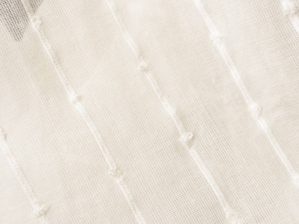 istock A close-up of a light translucent fabric that plays with the sun's rays, creating a feeling of lightness and airiness 2177850439