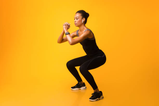 istock Black Sporty Girl Doing Deep Squat Exercise, Studio Shot 2177851344