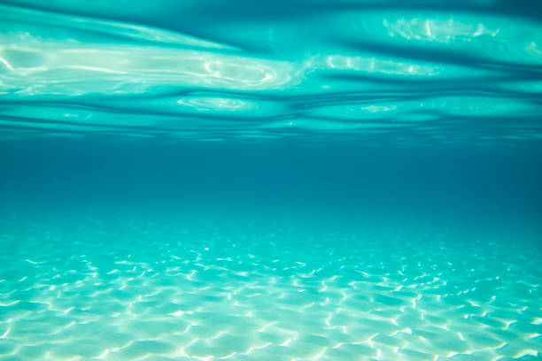 istock Underwater scene of turquoise blue sea, light reflections and sand 2177851914