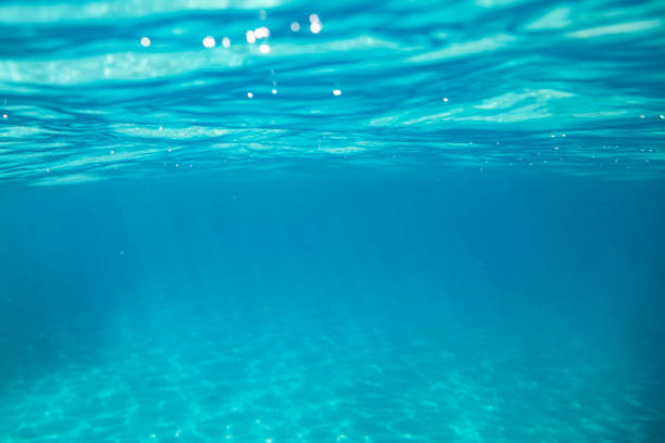 istock Underwater scene of turquoise blue sea, light reflections and sand 2177852455
