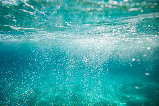 istock Underwater scene of turquoise blue sea, light reflections and sand 2177852666