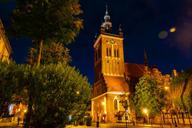 Beautiful night cityscape in Gdansk. Brick building of St. Catherine's Church
