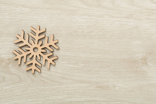istock Beautiful snowflake on wooden background, top view 2177852955