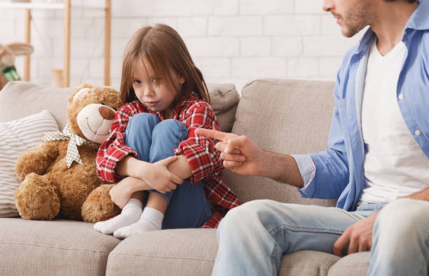 istock Little upset girl scolded by her angry dad 2177853879