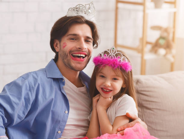 istock Cute little girl having fun with her daddy, taking selfie 2177853933