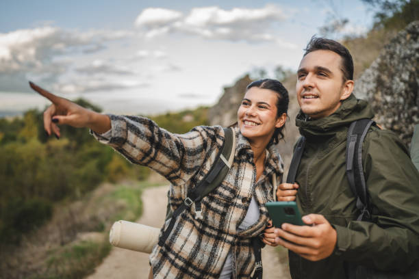 istock Boyfriend and girlfriend hikers explore forest with mobile phone 2177855420