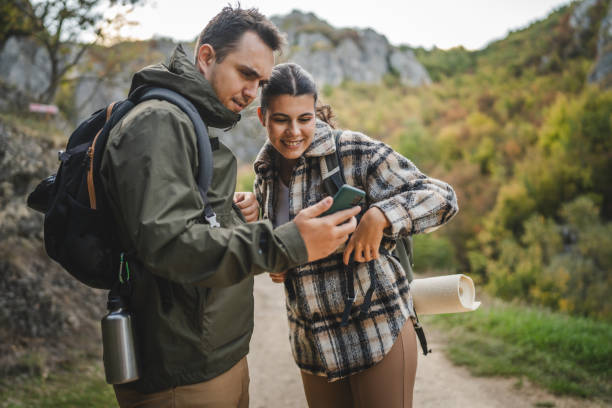 istock Boyfriend and girlfriend hikers explore forest with mobile phone 2177855493
