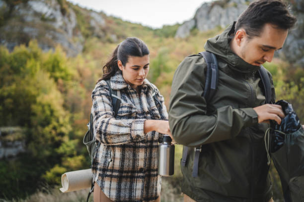 istock Girlfriend help boyfriend to pack and fasten his backpack 2177855746