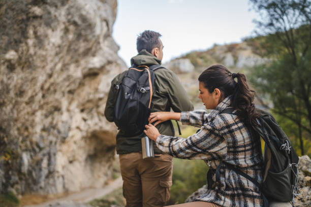 istock Girlfriend help boyfriend to pack and fasten his backpack 2177855879