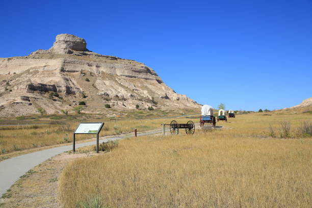 Gering-Nebraska, USA - September 19, 2022  : The scene depicts covered wagons traveling along the Mitchell Pass route at Scotts Bluff National Monument.