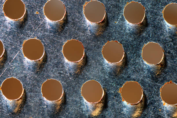 Metal surface with holes. Metal grater surface. Abstract background. Close up. Textured.