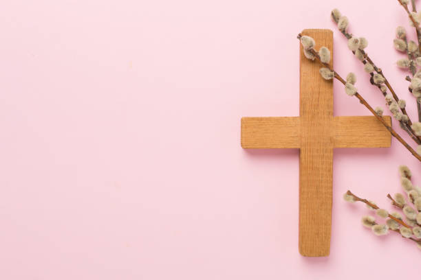 istock Cross with willow branches on color background, top, view. Palm Sunday concept 2177859649