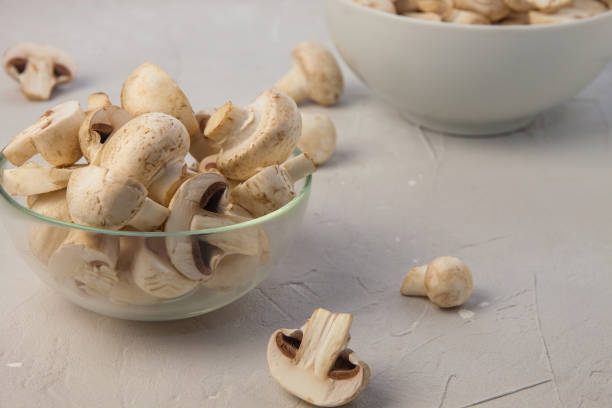 istock Sliced fresh champignons in round bowls 2177867018