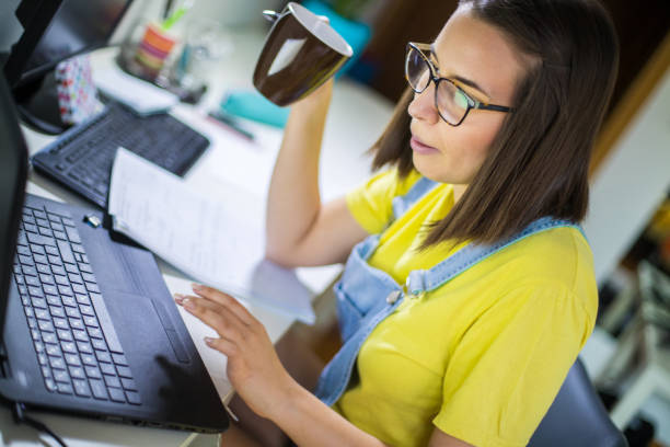 istock Young woman studying at home 2177867792
