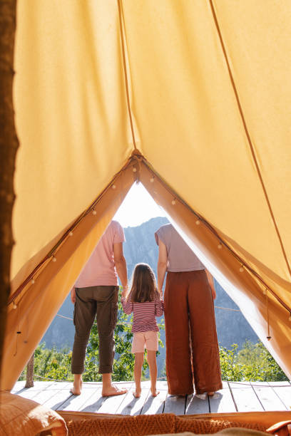 istock Family Enjoying Nature View From Inside a Tent 2177875956