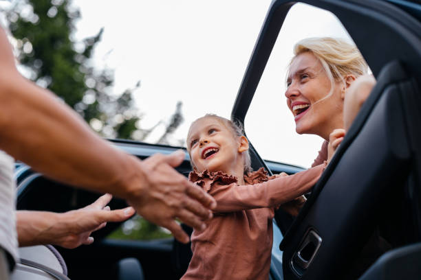 istock Happy Family Unloading Car During Outdoor Trip Adventure 2177875983