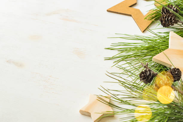 Eco christmas background with gift box and pine branches, wooden decor. Zero waste holidays