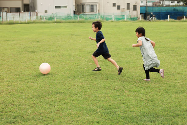 istock Children Runing and Playing At Park 2177882031