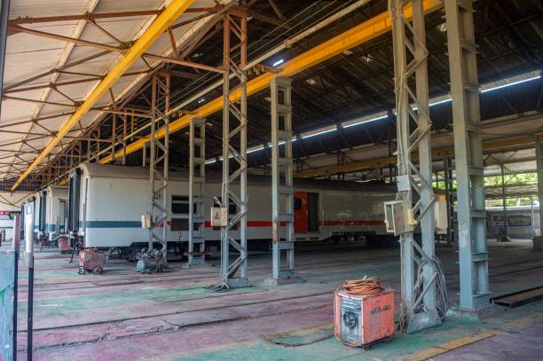 A train workshop at Balai Yasa Surabaya Gubeng, owned by PT Kereta Api Indonesia, showcasing maintenance and repair activities for train carriages, Indonesia, 6 October 2024.