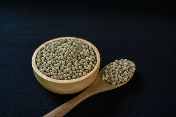 istock Pepper in wooden container on black background 2177886964