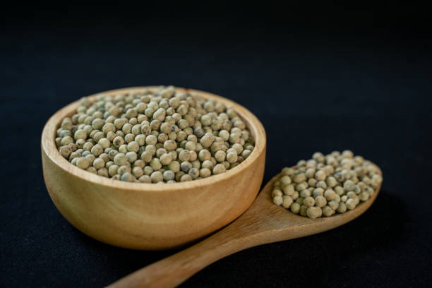 istock Pepper in wooden container on black background 2177886966