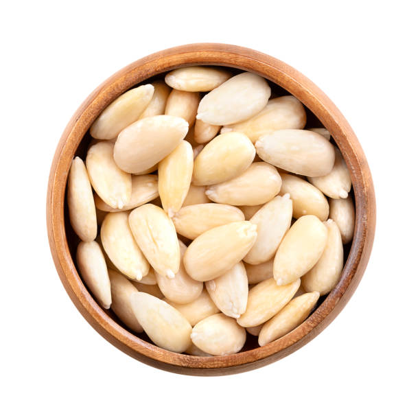 istock Freshly blanched almonds in a wooden bowl 2177892211