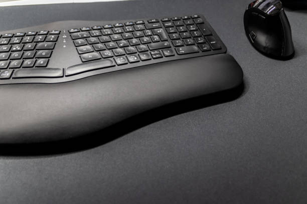 istock Ergonomic keyboard and ergonomic mouse as ergonomic home office equipment for freelance work and healthy workplace for notebook and clean desktop for efficient work from home for video editing graphic 2177898498