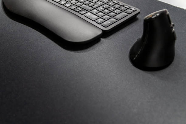 istock Ergonomic keyboard and ergonomic mouse as ergonomic home office equipment for freelance work and healthy workplace for notebook and clean desktop for efficient work from home for video editing graphic 2177898507
