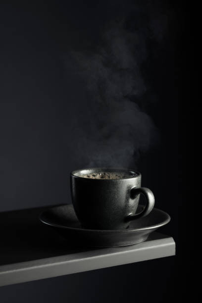 istock Black cup of coffee on a black background. 2177900813