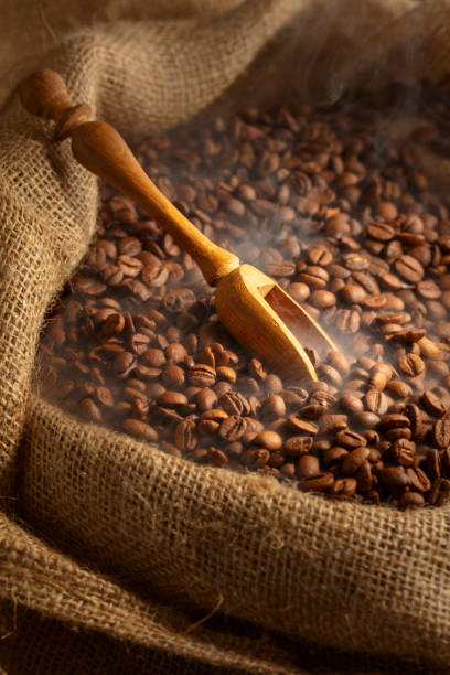 istock Fresh roasted coffee beans in burlap bag. 2177900825